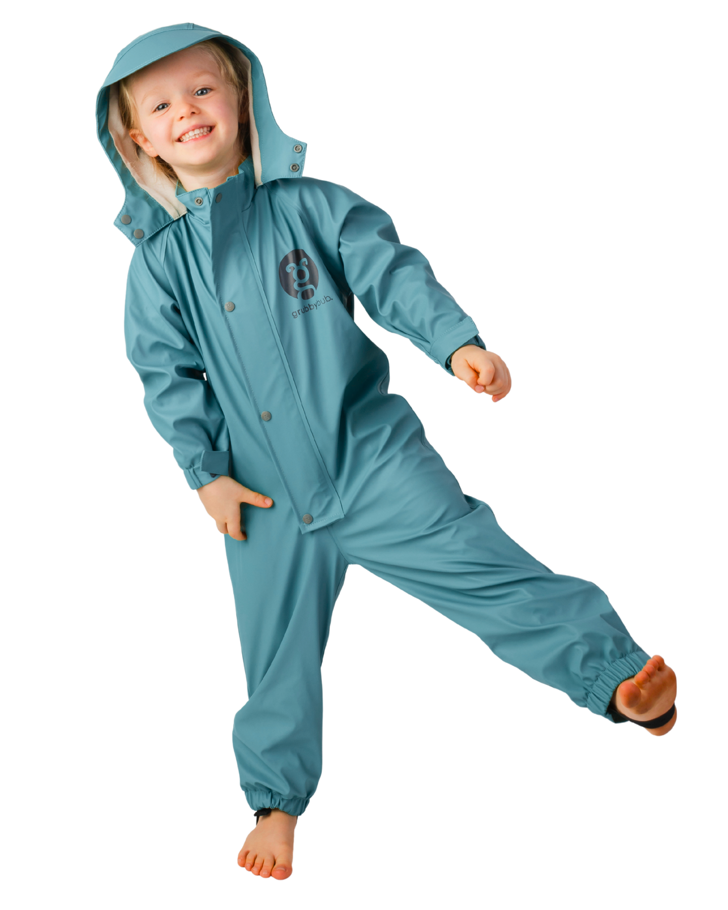 Kid wearing teal, deep sea green blue colour waterproof rain suit, flexible all in one kids rainwear for outdoor play