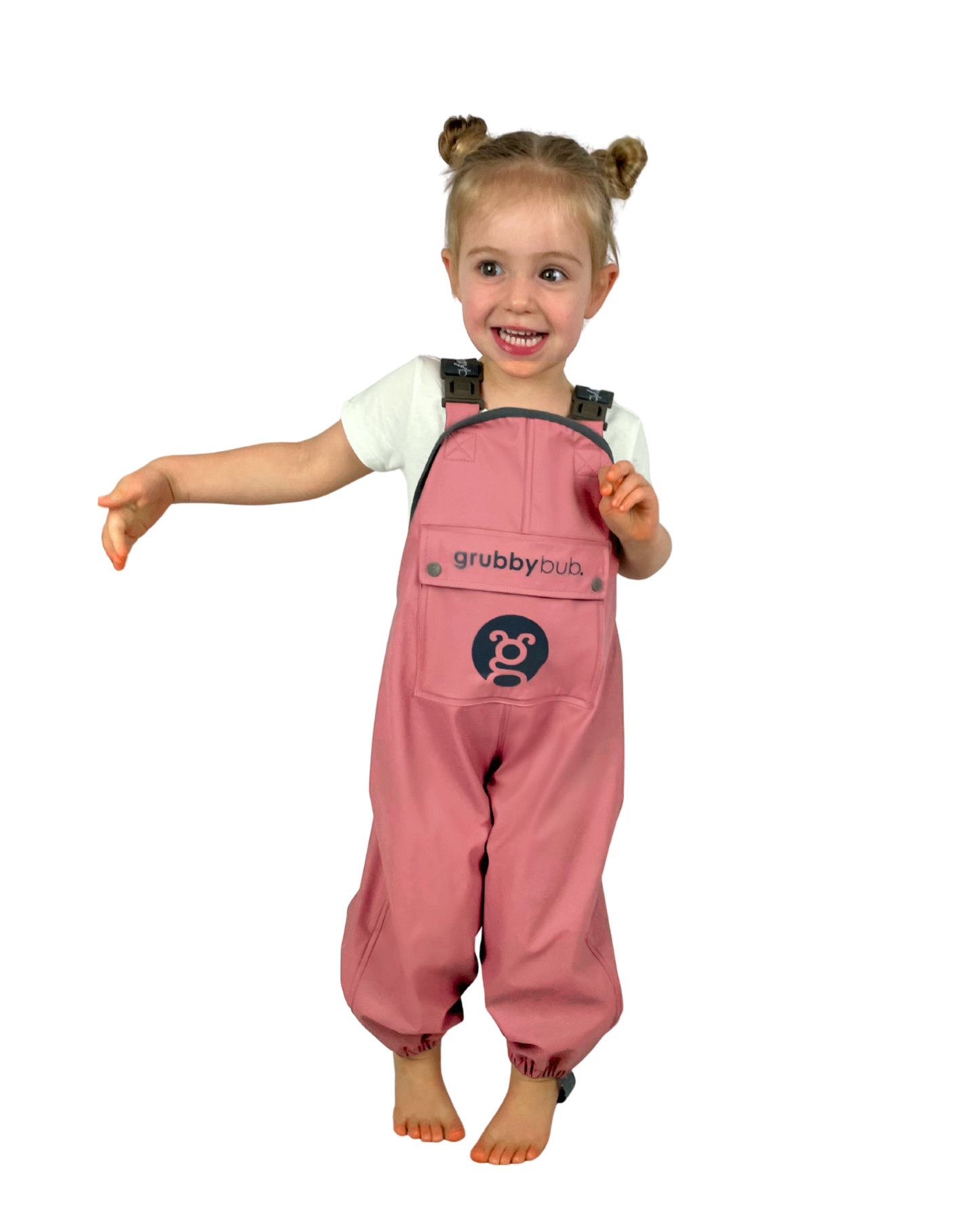 Child wearing pink 'grubbybubs' waterproof rain overalls on a white background