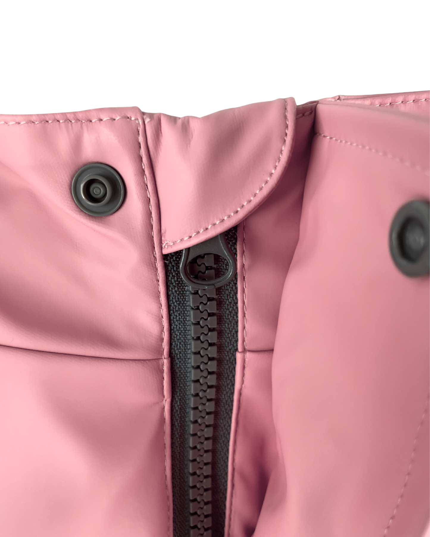 Kids waterproof jacket zip detail with storm flap, durable rain jacket with mud guard